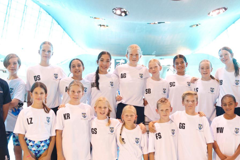 Brighton College Dubai swim squad group photo at the World School Games championships in London