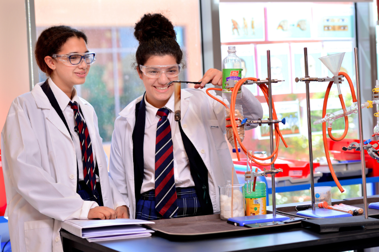 Brighton College Al Ain students conducting a chemistry experiment in the science lab.