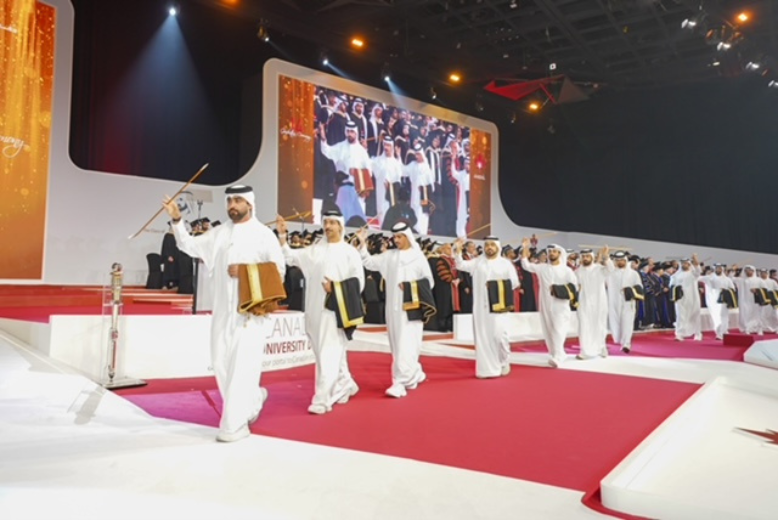 Emirati students leading a cultural parade at Canadian University Dubai’s 14th graduation ceremony.