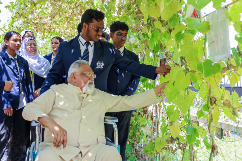 Founder Daniel Lazar of North Point Education visiting the student eco-garden with learners at The Royal Academy Campus