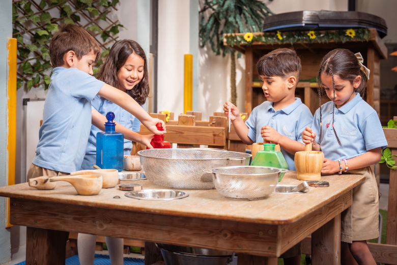 EYFS students at The Aquila School collaborating in a hands-on group learning activity.