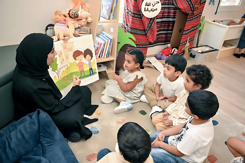 Teacher reading an Arabic book to kindergarten children in line with Arabic kindergarten policy