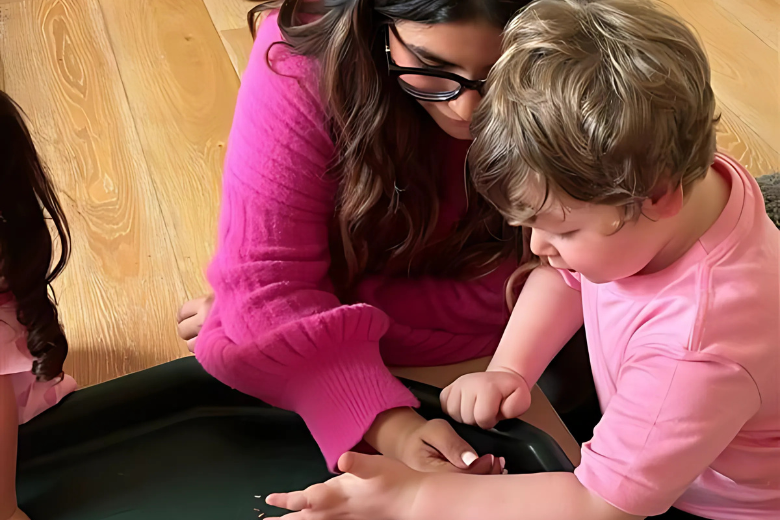 Dibber teacher providing one-on-one support to child of determination in inclusive early education setting