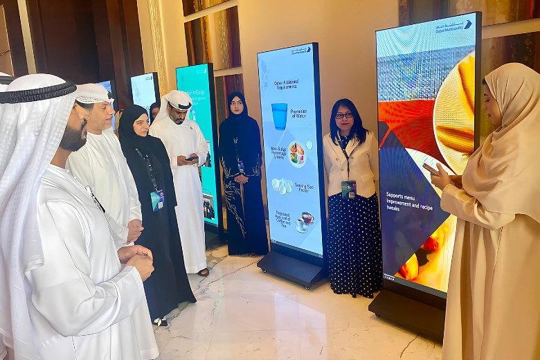 Marwan Ahmed Bin Ghalita, Director General of Dubai Municipality, and other officials being briefed about the My School Food digital platform at the 3rd Dubai Food Safety Forum on Tuesday. Image courtesy Gulf News