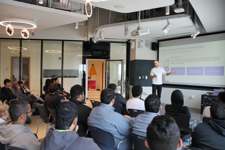 A mentor presenting the esports challenge to students during the EStars and ADEK hackathon at Yas Creative Hub in Abu Dhabi.