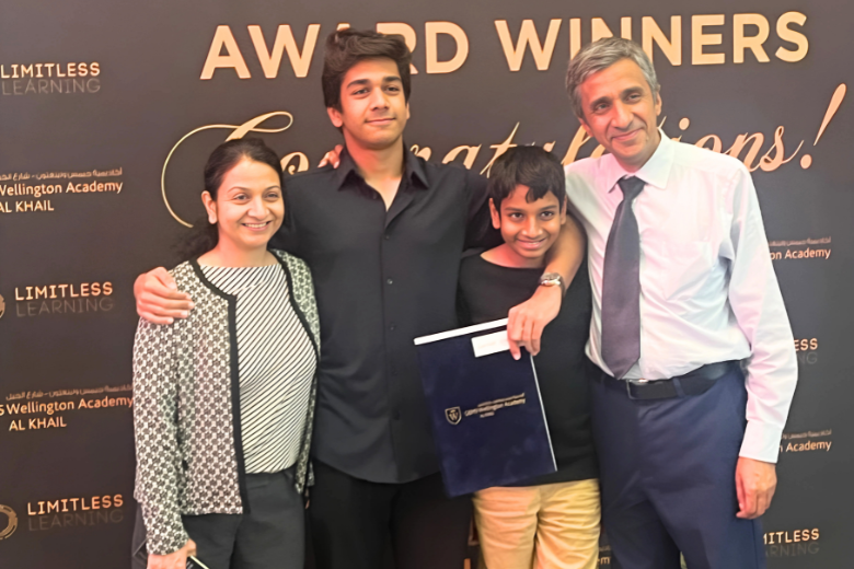 Garv Lamba with his family at GEMS Wellington Academy Al Khail after receiving a student award.