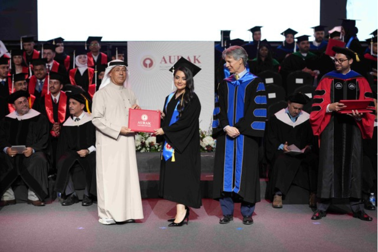 A graduate receives her degree at AURAK’s 14th Commencement Ceremony in Ras Al Khaimah.