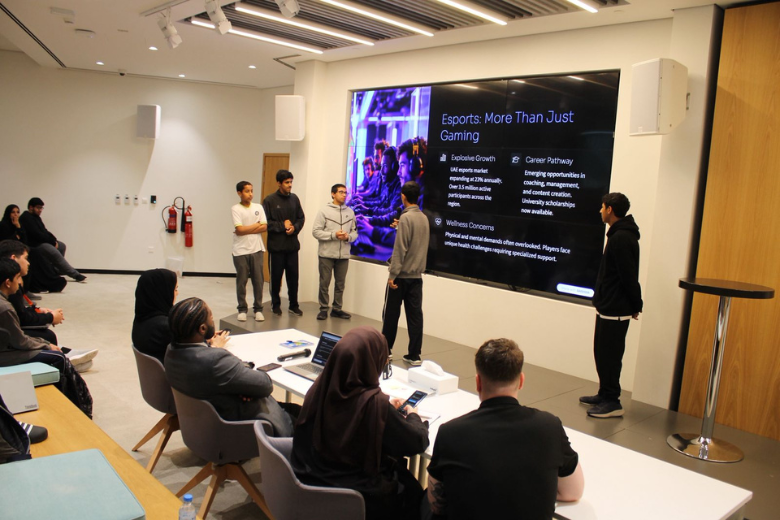 A student team pitching their concept on esports beyond gaming to a panel at the EStars hackathon in Yas Creative Hub.