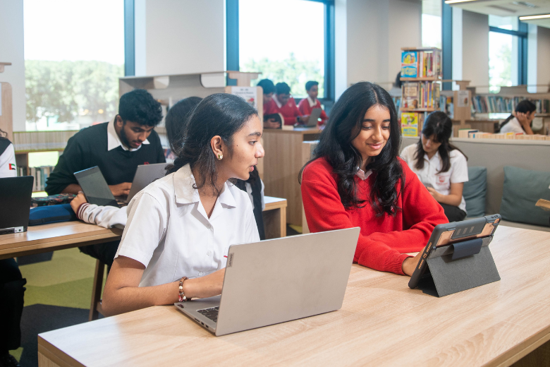 Secondary students studying and collaborating in the library at The English College