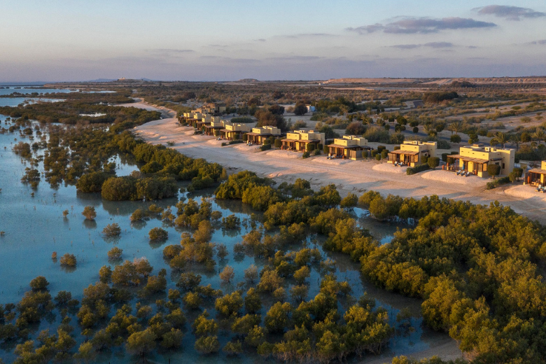 Aerial view of beachfront eco villas at Anantara Al Yamm on Sir Bani Yas Island