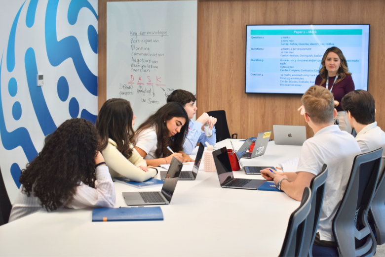 Senior students at Bloom World Academy discussing AI ethics and digital literacy in a critical thinking lesson