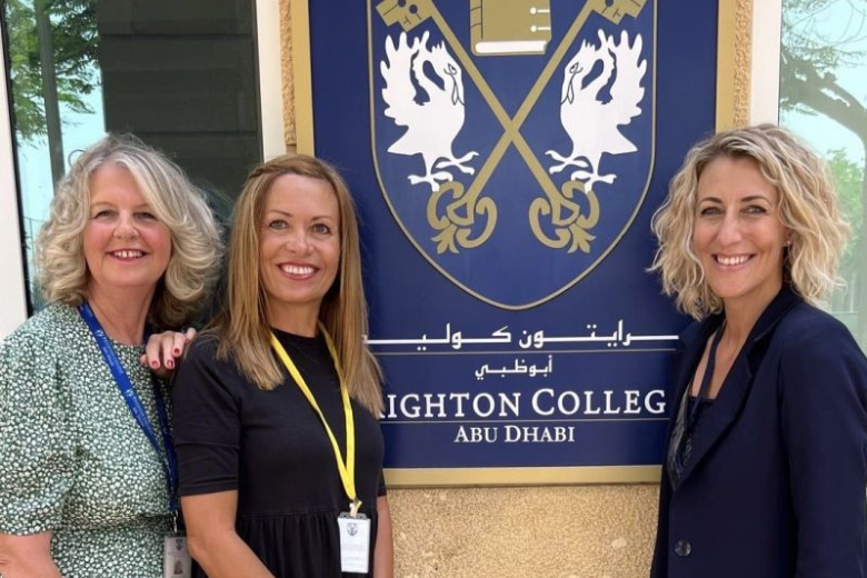 Brighton College Abu Dhabi leadership team outside the school entrance.