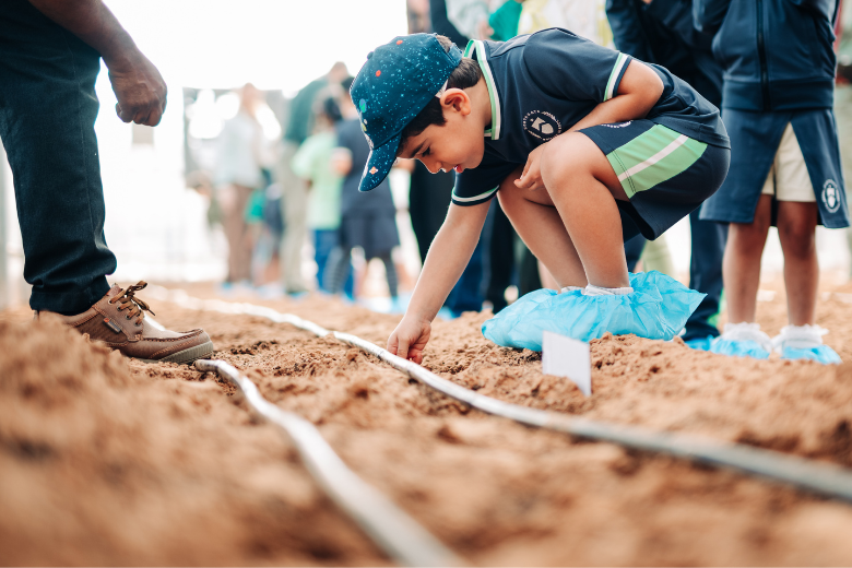 North Gate British School student participating in outdoor eco-activity in Ajman