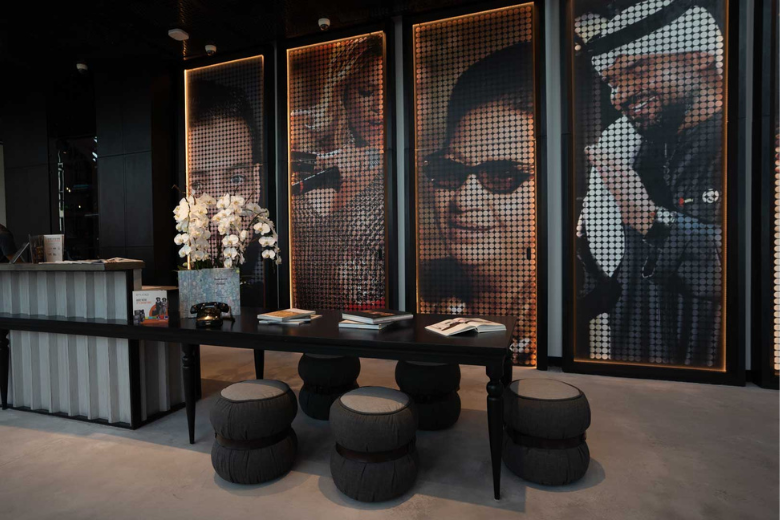 Pop culture-inspired wall art and stylish lounge seating in Studio One Hotel lobby