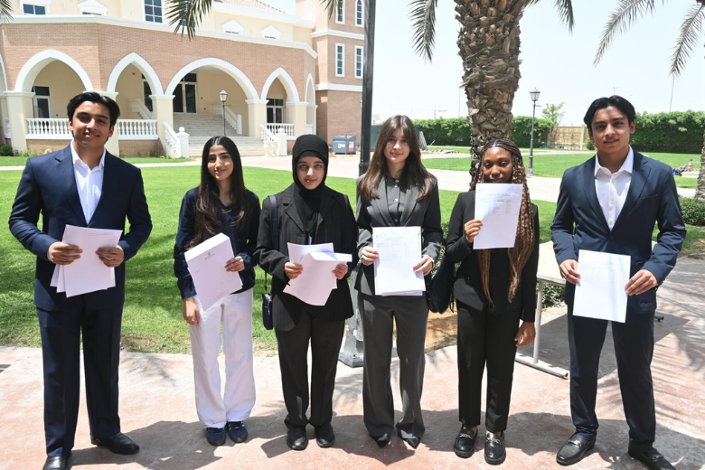 Group of Repton Dubai students celebrating GCSE results 2025 with certificates.