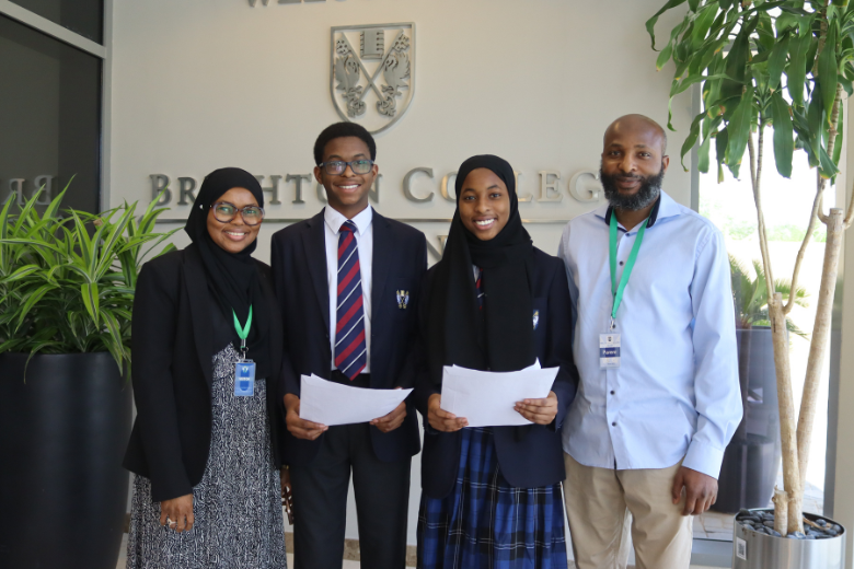 Brighton College Al Ain pupils Ibrahim and Fatimah Towobola celebrating their GCSE success in 2025 with their proud parents.