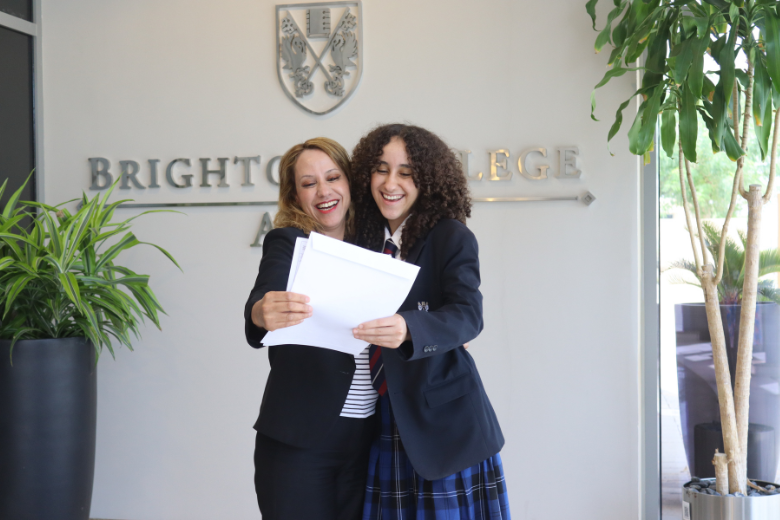 Brighton College Al Ain pupil Lea Hennebelle celebrating her GCSE success in 2025 with her mother.