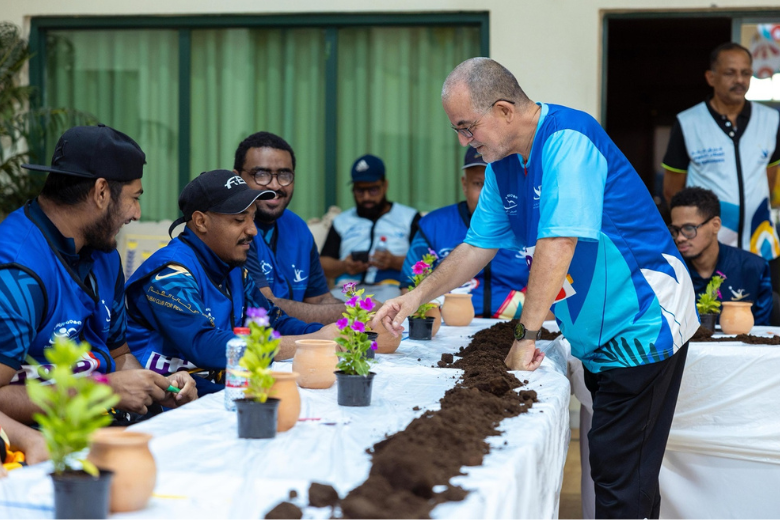 Students of determination participating in an inclusive gardening activity at KHDA-supported summer camp.
