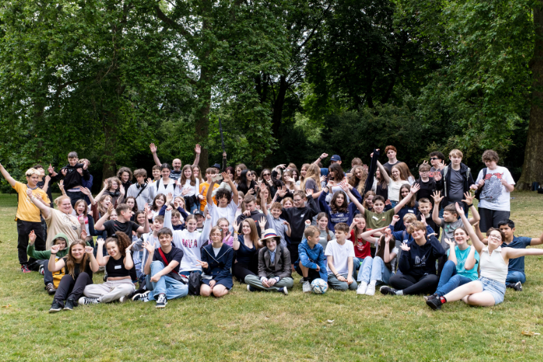 Large group of Minerva Virtual Academy students gathered for a community event in the park.
