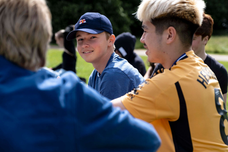Minerva Virtual Academy students enjoying conversation during an outdoor school activity.