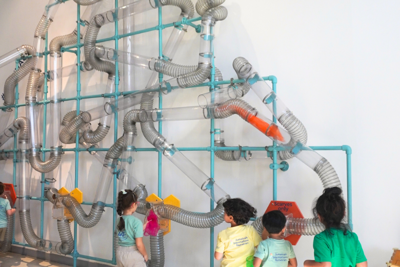 Students engaging with the Amazing Airways tubes and airflow system during an OliOli® school trip