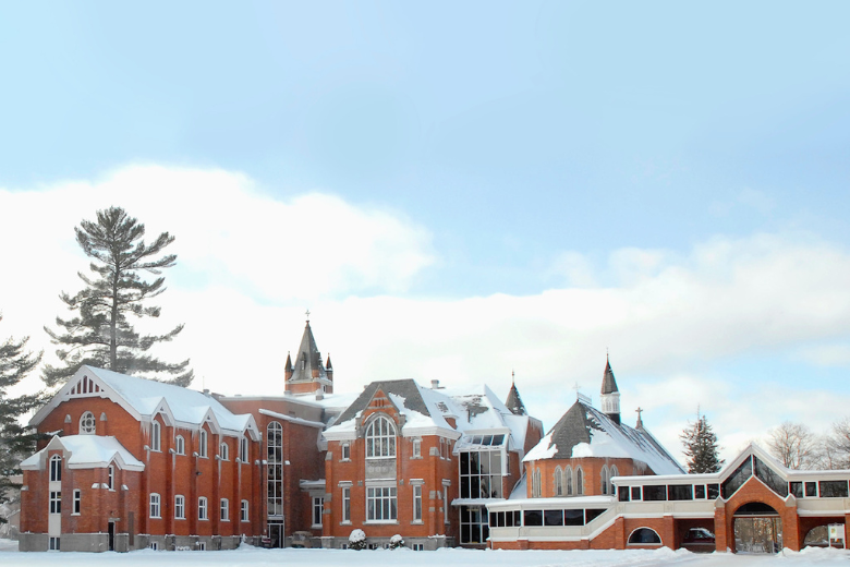 Bishop’s University Quebec campus in winter with snow-covered historic buildings