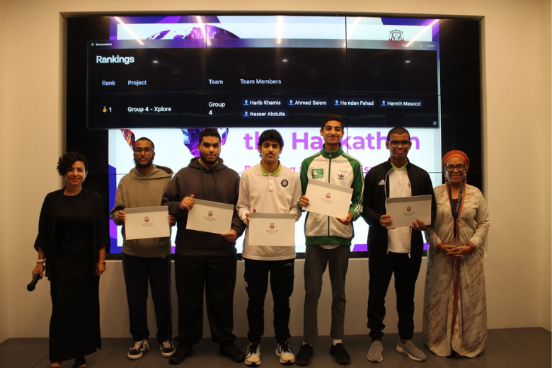 Learners hold certificates after an EStars programme with mentors standing beside them