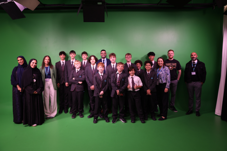 Group of secondary learners with teachers in a green screen studio during an EStars BTEC Level 2 visit