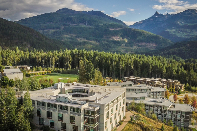 Quest University campus in British Columbia surrounded by mountains and forests