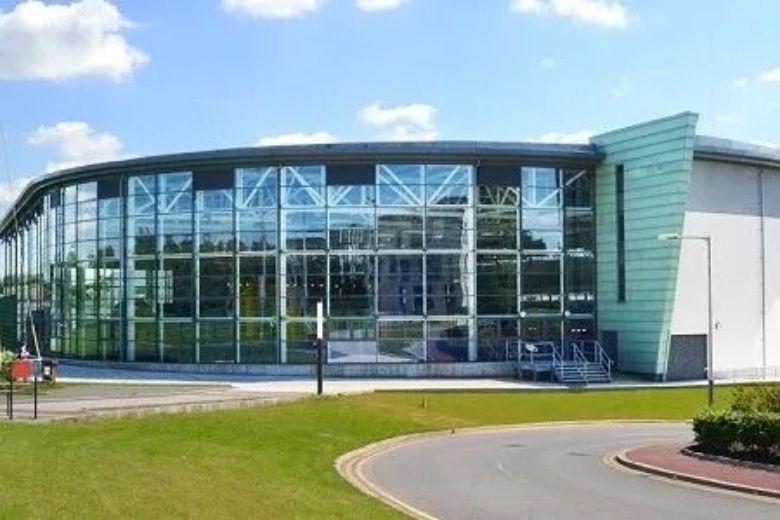 Academic buildings and campus facilities on a sunny day
