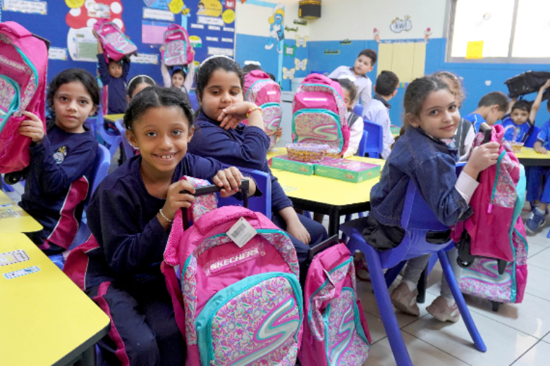 Students at a UAE charity school receiving school bags donated through the Students for Students initiative in partnership with Skechers.