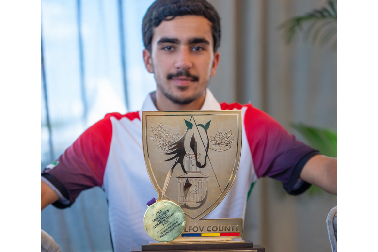 Rashed Mohammed Atiq Almehairi proudly displays his FEI Endurance World Championship trophy and gold medal
