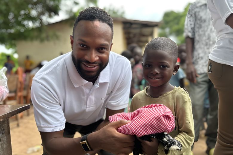 Young Togo kindergarten students proudly showing their uniforms