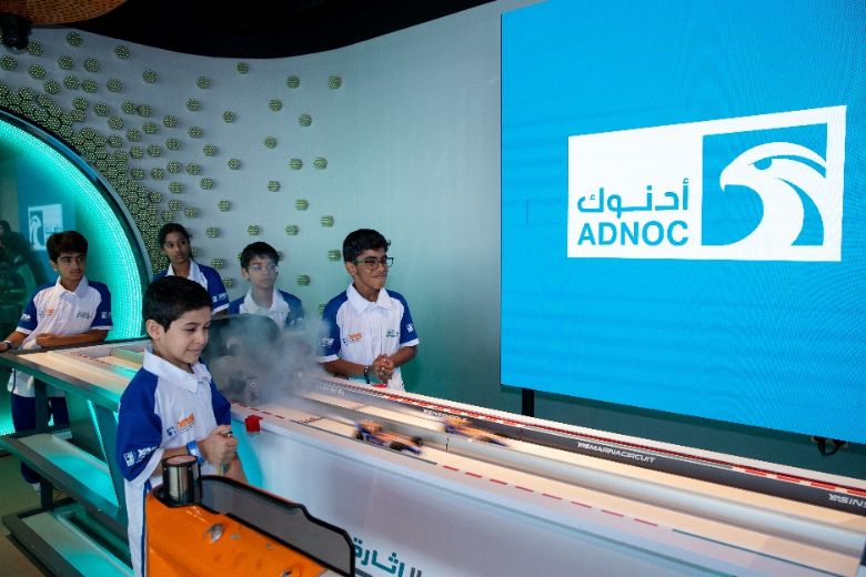 Students racing Formula Ethara cars at the Yas in Schools Experience Centre