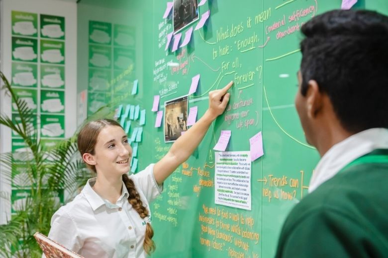 Students working together in a modern classroom at Arbor School Dubai