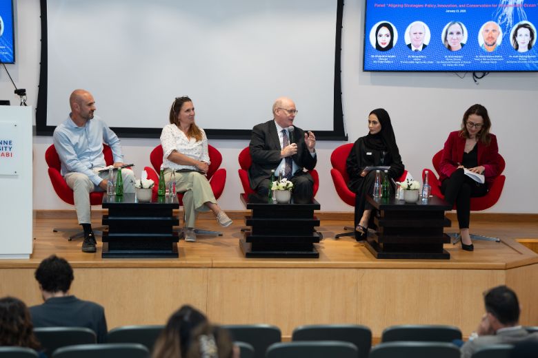 Researchers and students at Sorbonne University Abu Dhabi discussing AI innovation