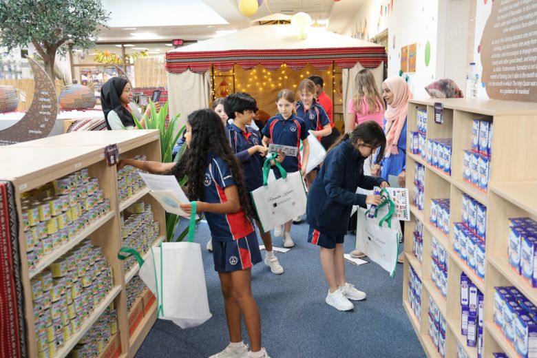 Pupils assembling Ramadan care bags at Ranches Primary School community Souk event