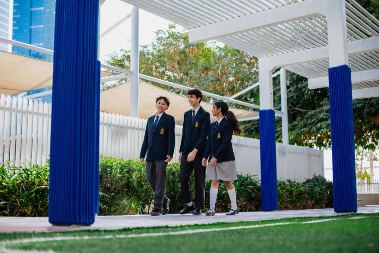 Pupils walking together across the school campus between lessons in a safe and welcoming environment