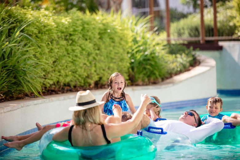 Families enjoying water slides at Centara Mirage Beach Resort Dubai