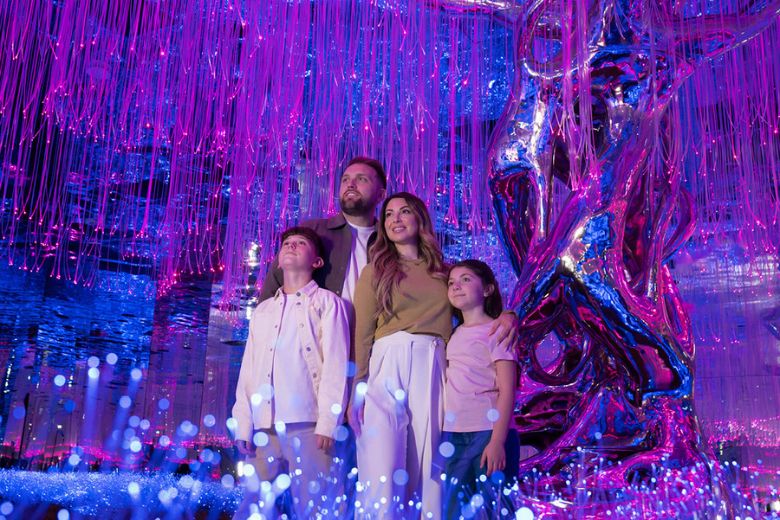 Family exploring interactive digital rooms at AYA Universe Wafi City
