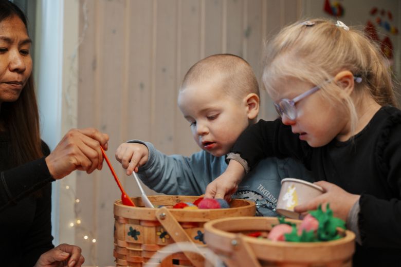 Child learning through play with support from parents and teachers