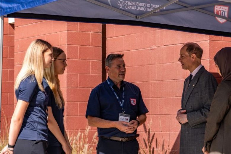 Students and teachers interact with the Duke of Edinburgh during his visit to Dubai College