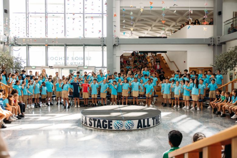 Children participating in a school forum celebration 