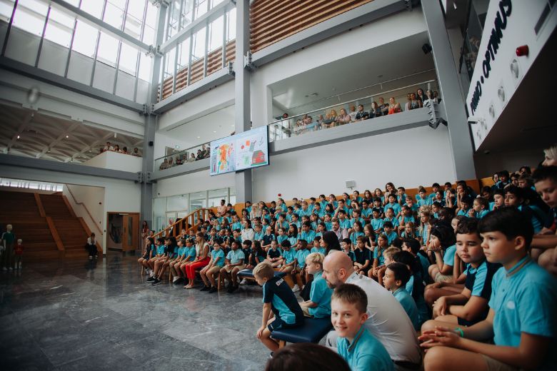 Students attending a forum in the school auditorium