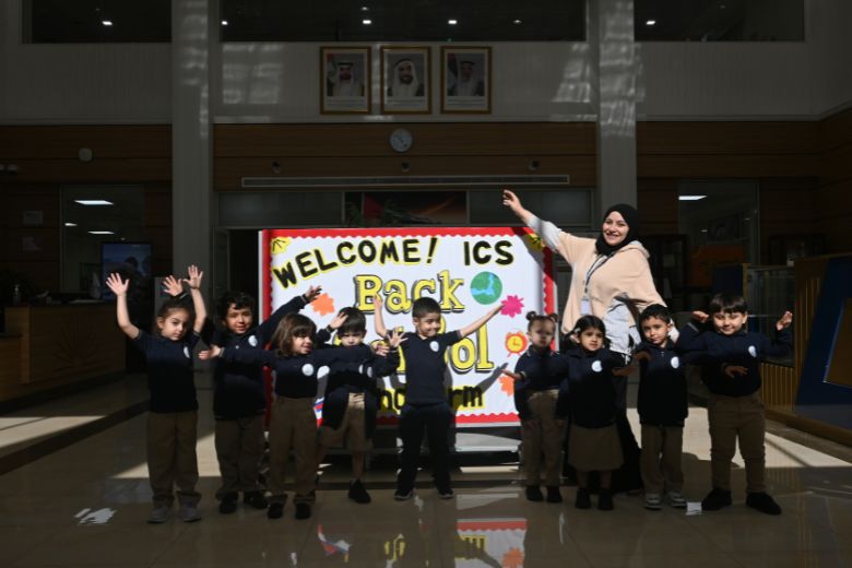 Teachers welcoming students at school entrance in Abu Dhabi