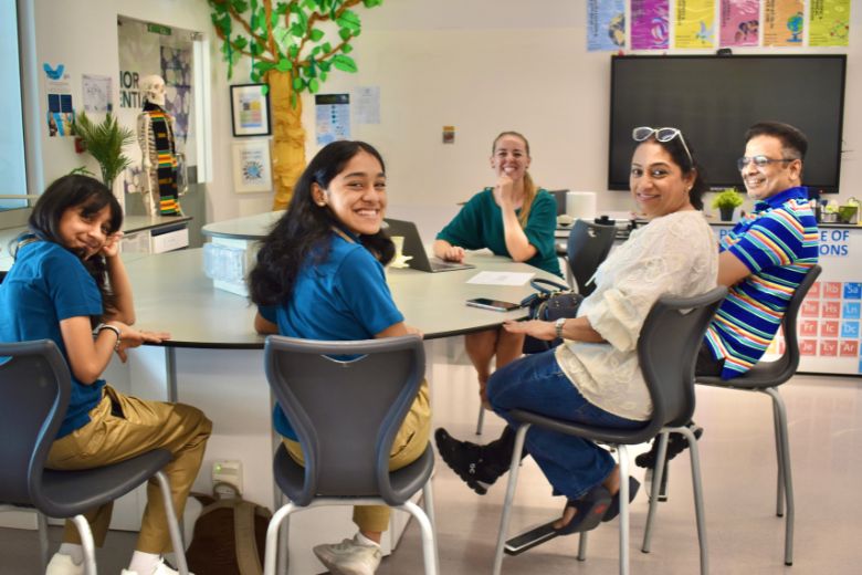 Parents and students engaging in a learning celebration event at school