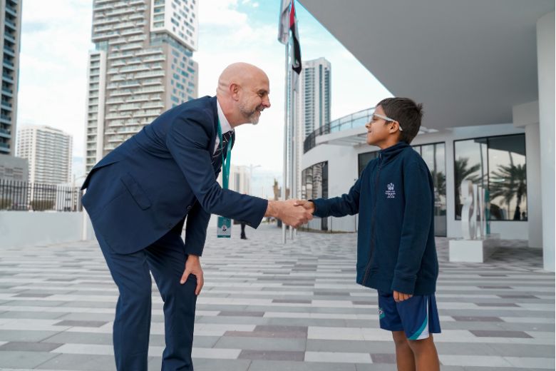 Principal, Liam Cullinan of Nord Anglia International School Abu Dhabi with a student
