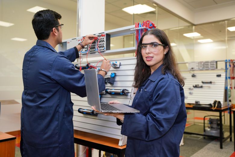 Engineering student conducting a practical lab session in industrial and engineering management at Canadian University Dubai