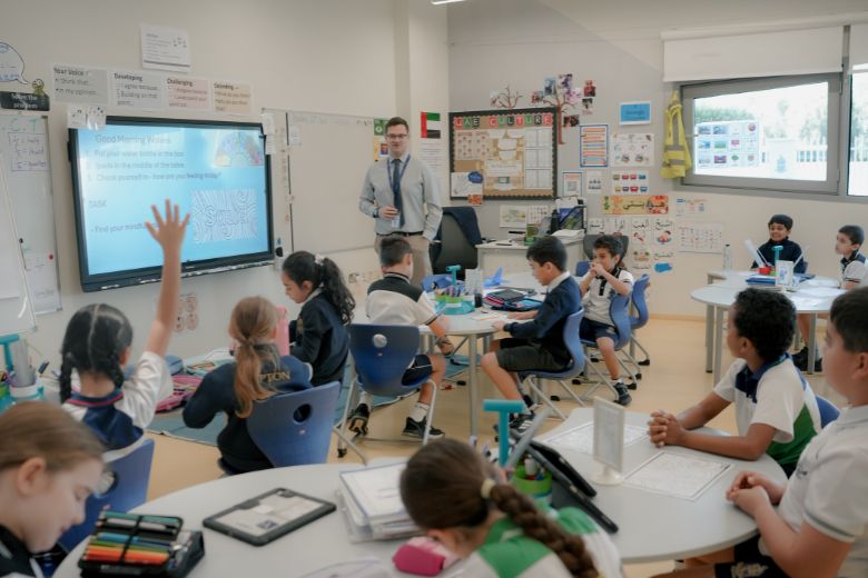 Children seated in a classroom at Repton Abu Dhabi, engaging in lesson activities