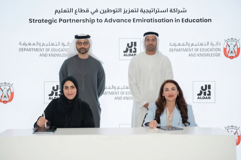 ADEK and Aldar Education leaders signing Emiratisation partnership agreement in Abu Dhabi